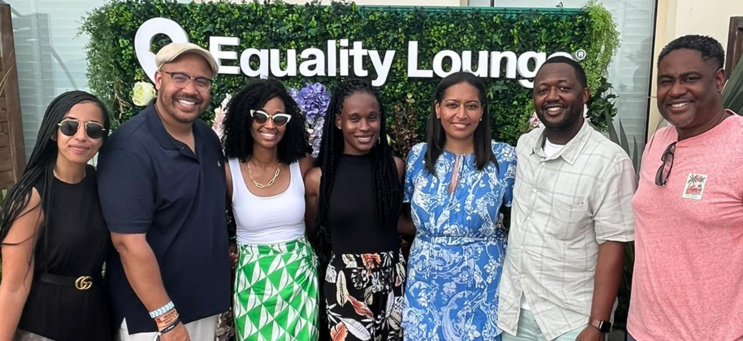 BECA Members standing in front of the Equity Lounge sign.