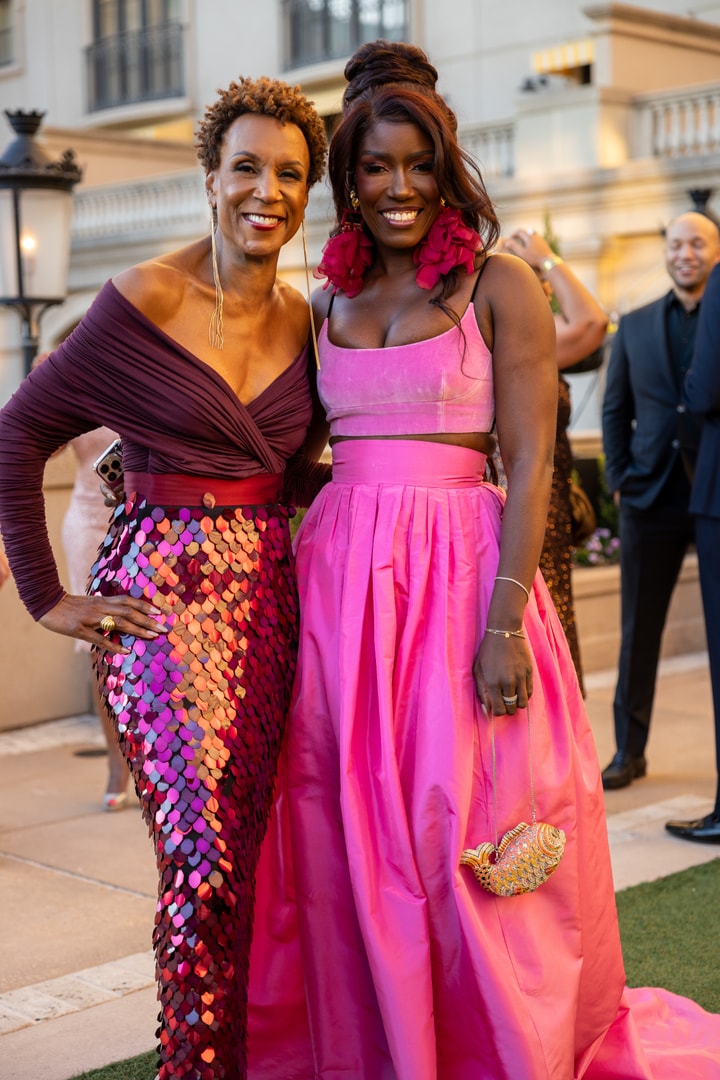 Jerri and Bozoma, elegantly dressed for the gala, smiling and posing for a photo.