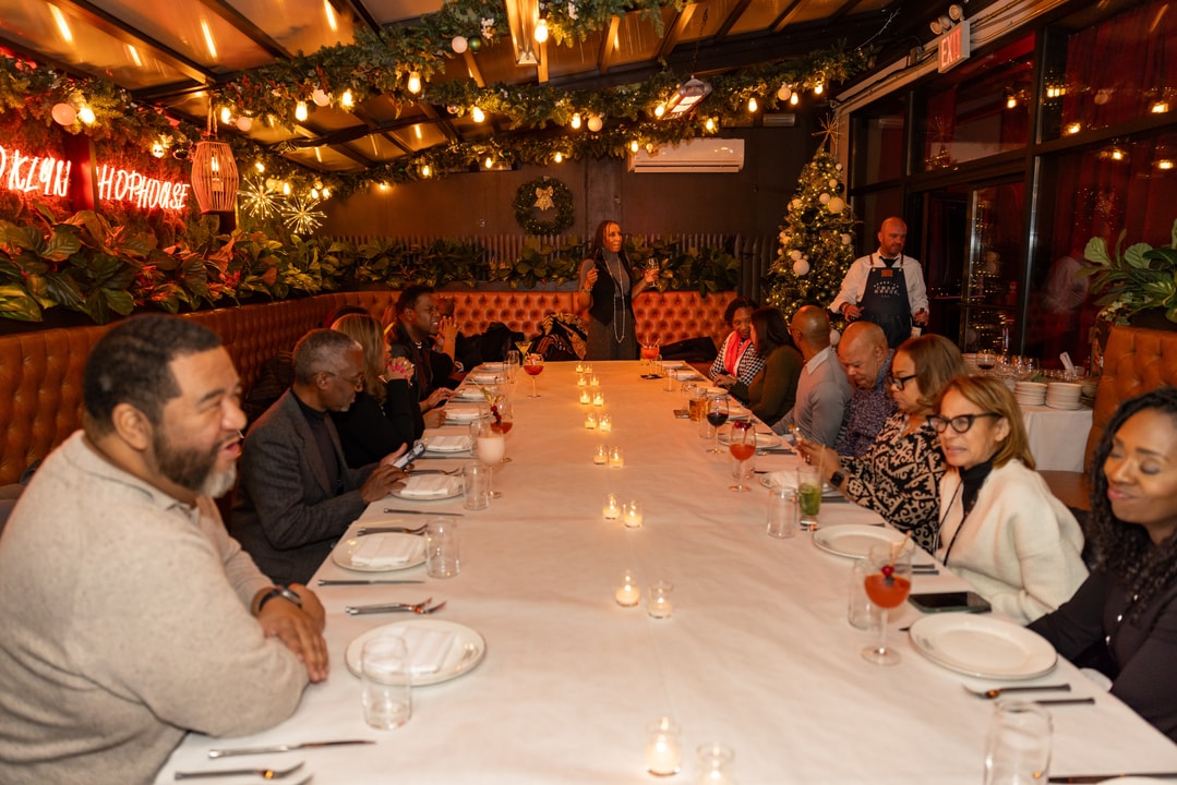 Jerri DeVard at the head of the table as BECA Members enjoy cocktails at the Brooklyn Chophouse
