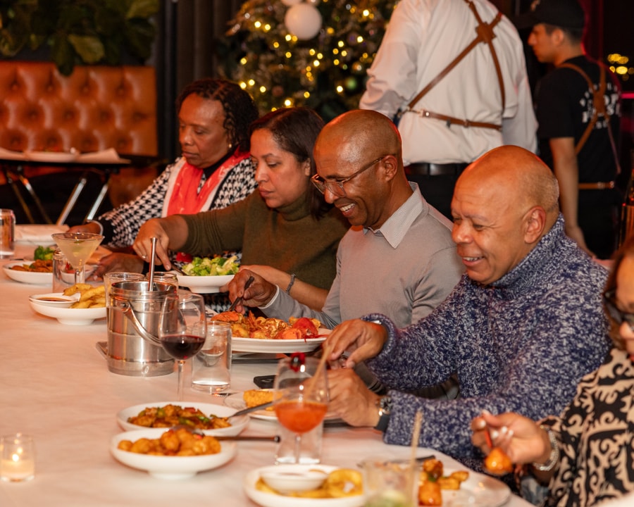BECA Members smile and eat at Brooklyn Chophouse.