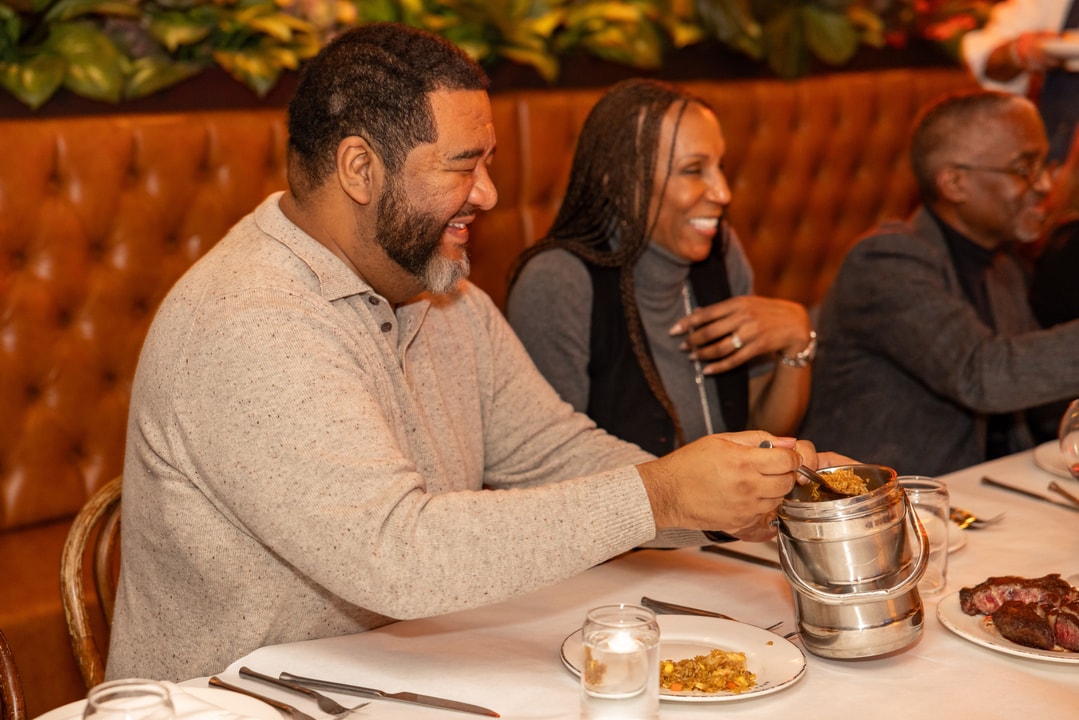BECA Members engaged in coversation while eating at Brooklyn Chop House.