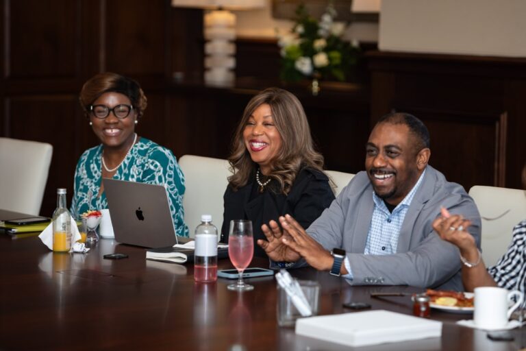 BECA Members smile and talk at the October 2024 Member Meeting.