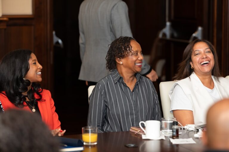 BECA Members smiling and laughing at the October 2024 Member Meeting.