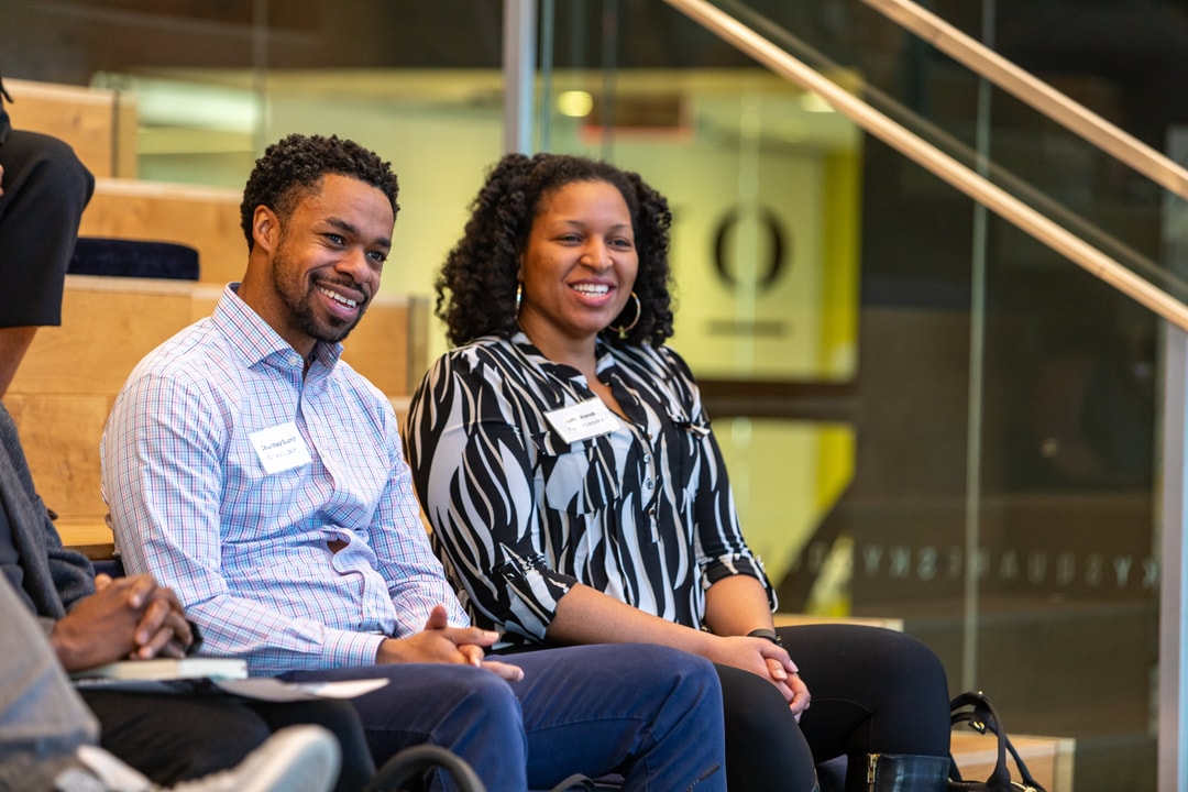 Two Future Leaders are actively listening at the BECA Playbook kickoff.