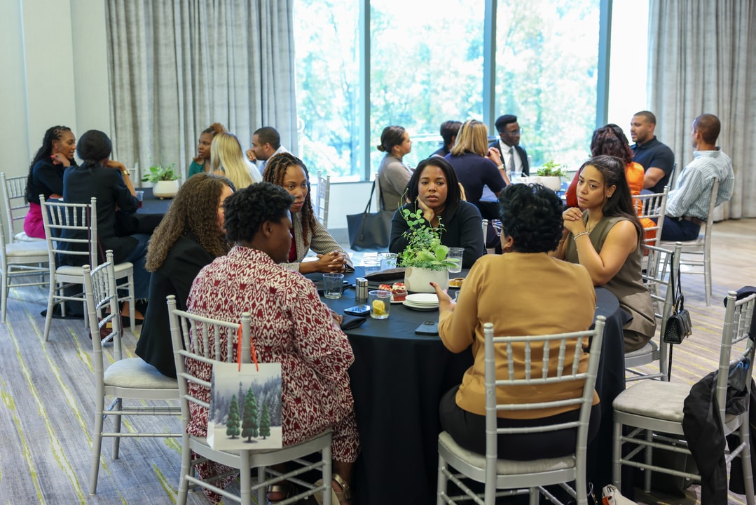 A group shot of BECA Future Leaders talking during their luncheon.